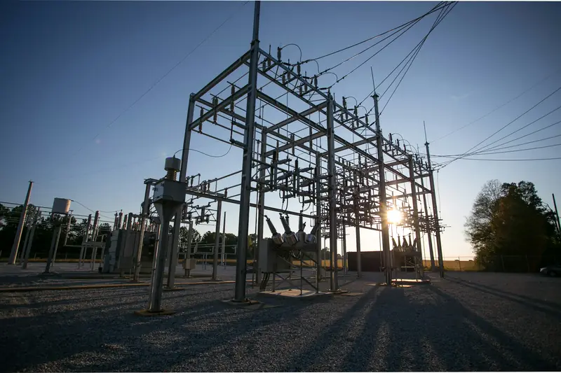Electrical substation steel structures and transformer at dusk