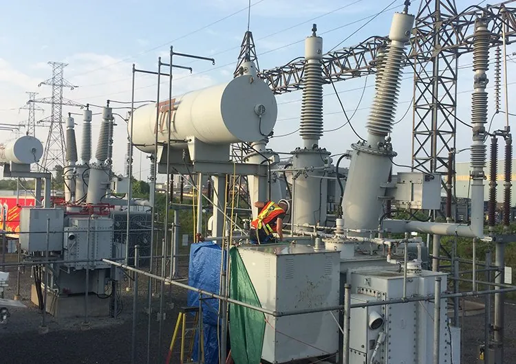 Technician servicing a 27.6 kV substation transformer at Atlantic Packaging, Whitby